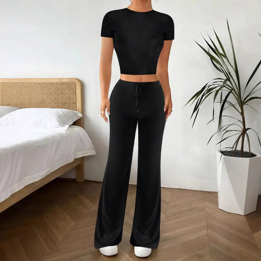 Black high waist trousers and regular sleeve t-shirt suit set on a model, showing the coordinated two-piece outfit