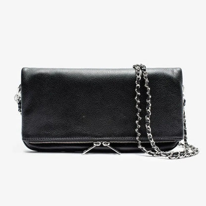 Soft black PU leather women's clutch bag with a gold chain strap, shown held and worn cross-body.