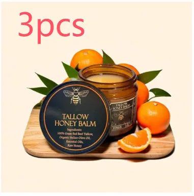 Glass jar of Honey Butter Moisturising Facial Cream with 57g net content label, shown with a dab of cream.