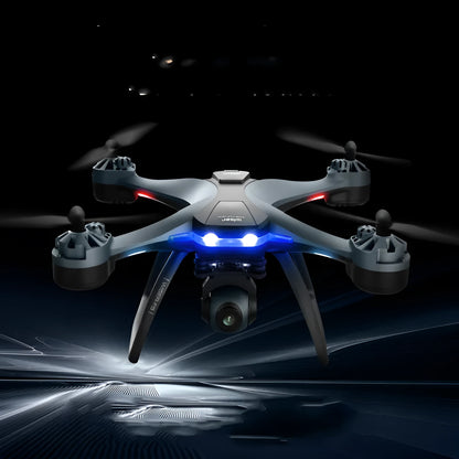 Black plastic quadrocopter drone with four rotors, remote control handle, and dual cameras
