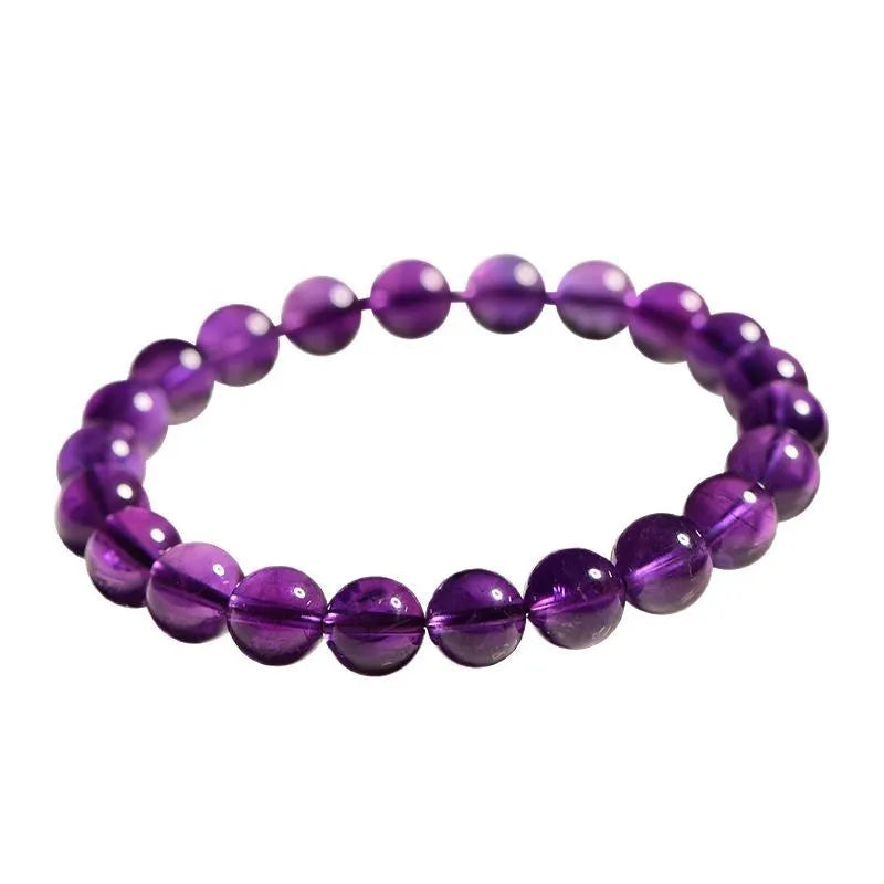 Natural amethyst scattered beads bracelet from Uruguay showing purple crystal beads in various sizes from 4mm to 16mm diameter