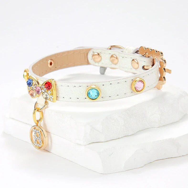 White cat collar with silver diamond alloy bow showing four size options from 26cm to 38cm length