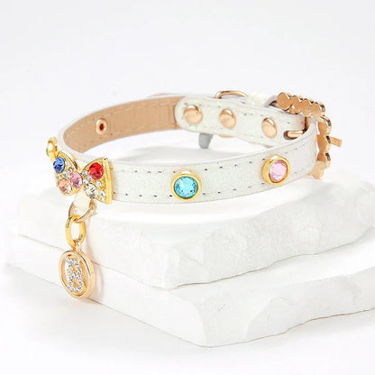 White cat collar with silver diamond alloy bow showing four size options from 26cm to 38cm length
