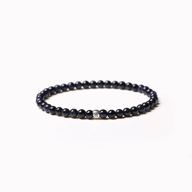 Geometric unisex bracelet with small Obsidian, blue San, and textured black agate beads.