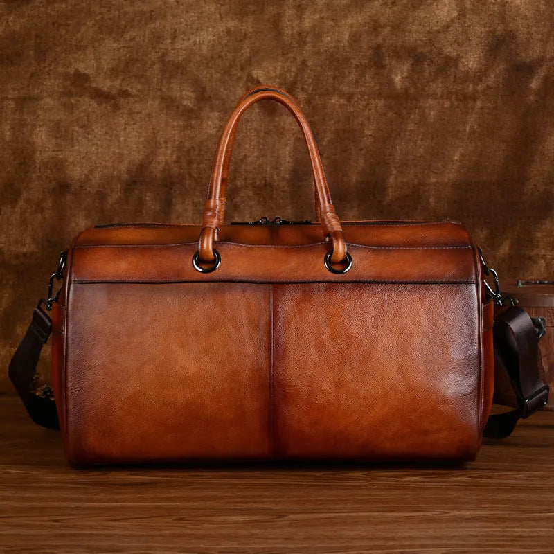 Genuine leather handbag handmade from first layer cowhide in retro style with large capacity below 20L for leisure travel, available in vintage brown or retro coffee colour