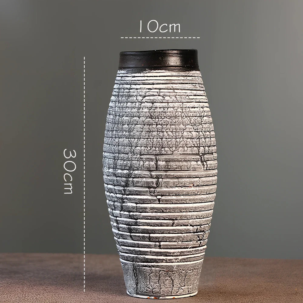 Ceramic mosaic vase with dried flowers, showing mosaic pattern and 25cm height