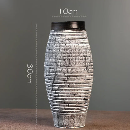 Ceramic mosaic vase with dried flowers, showing mosaic pattern and 25cm height