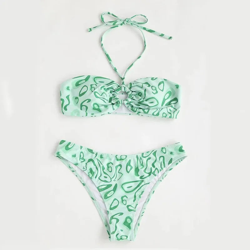 Blue floral pattern bandeau bikini swimsuit with backless design on mannequin