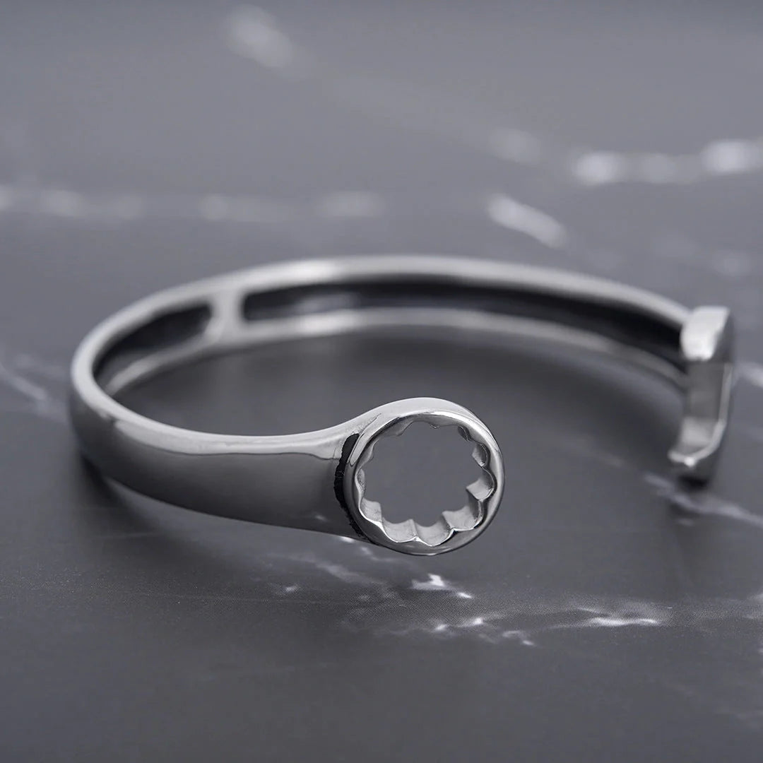 Sleek stainless steel personalized wrench bracelet with adjustable clasp, showcasing industrial-chic style