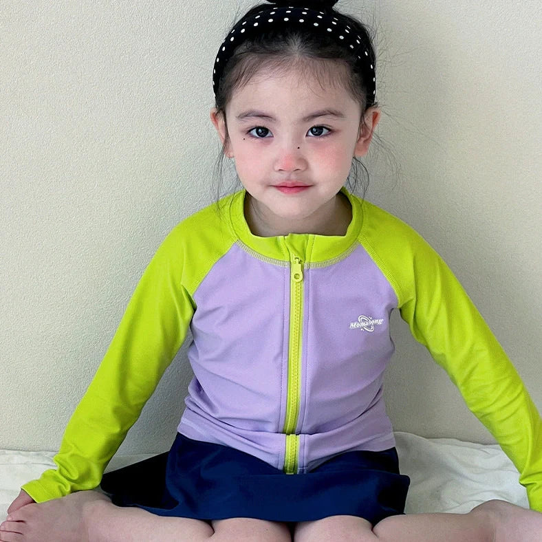 Girls' long sleeve swimsuit with split skirt in gradually varied pink colour, showing complete arm coverage and skirt design