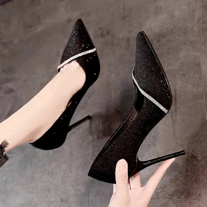 Women's black and gold pointed toe stiletto high heels with low-cut vamp