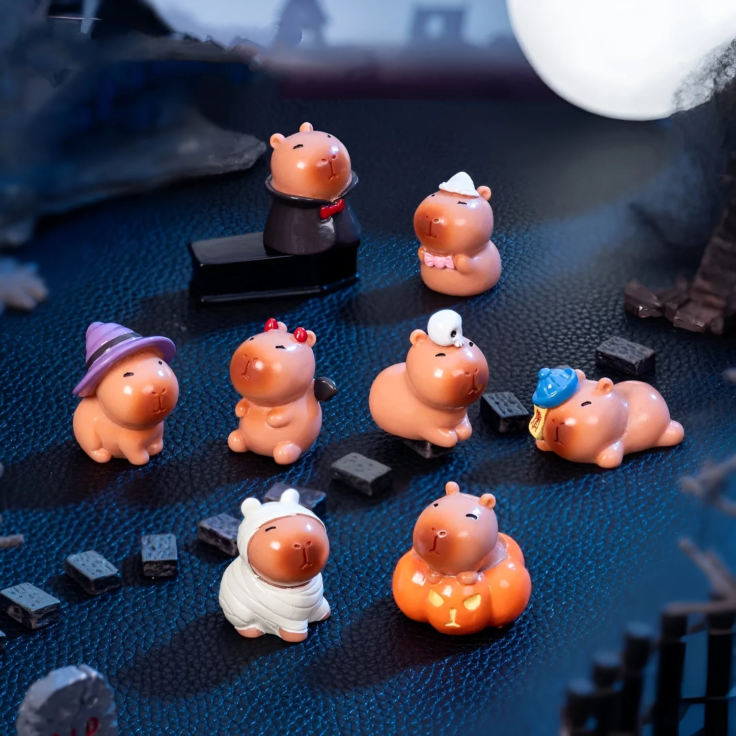 Eight Halloween character capybara resin decorations including pumpkin, zombie and vampire designs