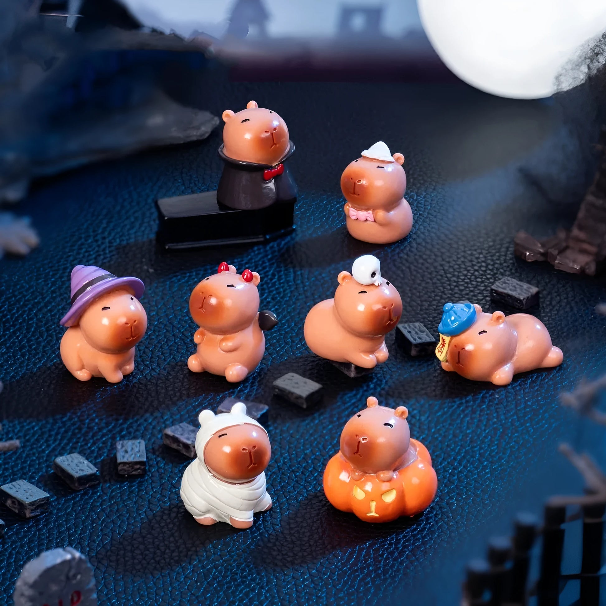 Eight Halloween character capybara resin decorations including pumpkin, zombie and vampire designs