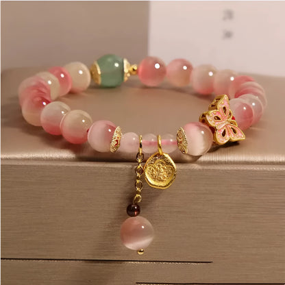 Pink opal butterfly women's bracelet with Chinese-style detailing and electroplated metal