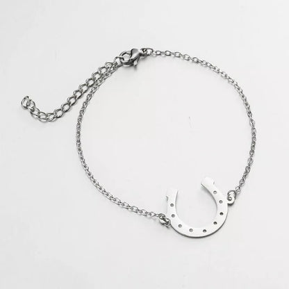 Punk Horse Shoe Chain Bracelet in gold and steel colors, featuring a unique U-shape charm