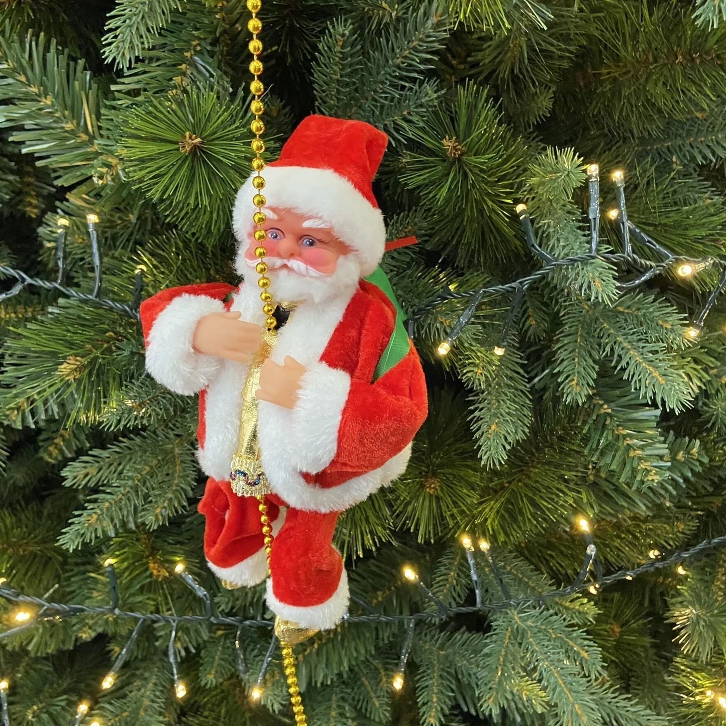 Electric Santa Claus climbing ladder decoration measuring 20cm tall with continuous motion mechanism