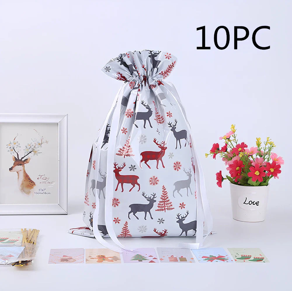 Christmas gift bag with drawstring closure in laser gold finish, 32x24cm dimensions