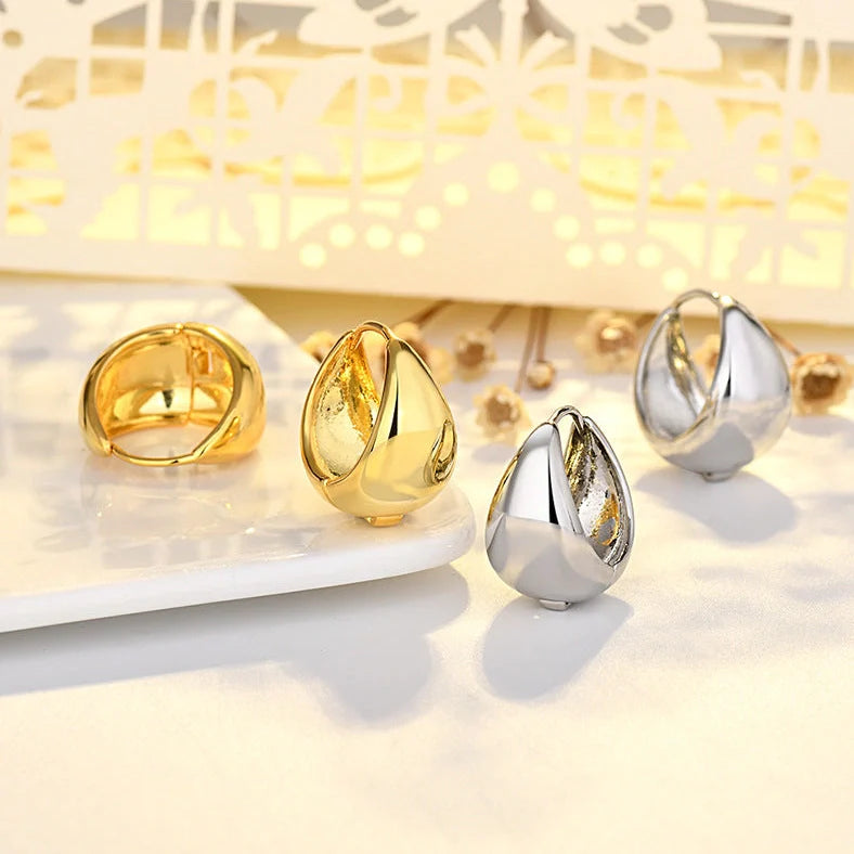 Women's geometric circle earrings with gold inlay treatment and water drop ear clip design