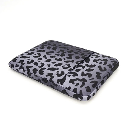 Leopard print waterproof laptop sleeve for 13-inch to 16-inch devices with anti-shock flannel protection.