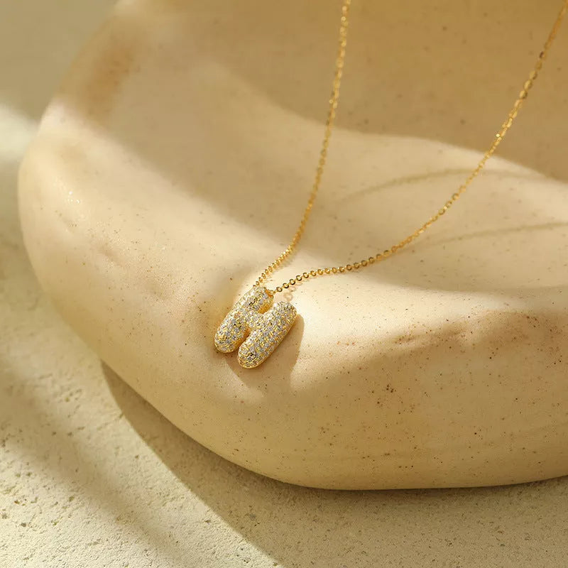 Stainless steel initial pendant necklace with zircon accents, personalized with your choice of letter.