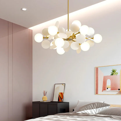 Nordic minimalist chandelier with multiple light heads in metal and glass construction