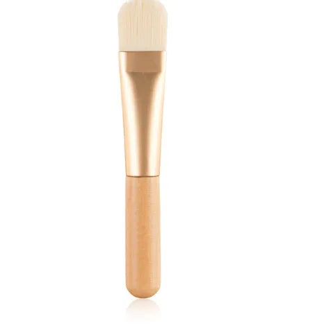 Wooden handle facial treatment brush, 12cm total length, 2cm artificial fibre bristles, black or wood colour.
