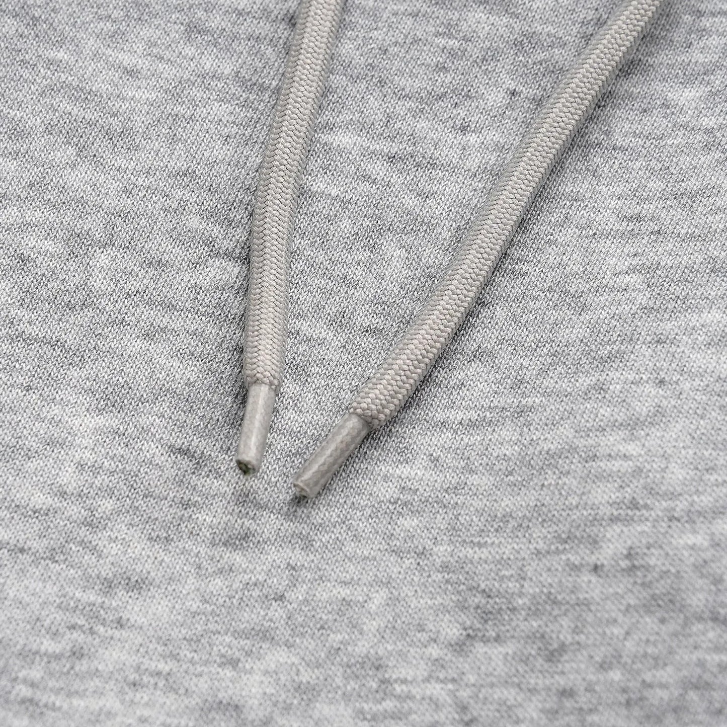 Men's straight-leg grey cotton casual trousers with an elasticated waistband laid flat.