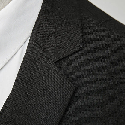 Men's navy blue slim fit three-piece suit with waistcoat on a hanger