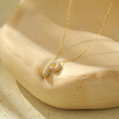 Stainless steel initial pendant necklace with zircon accents, personalized with your choice of letter.
