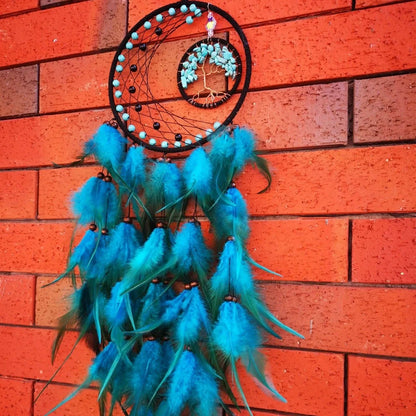 Handmade feather dream catcher wall art with 16cm circular frame and natural materials