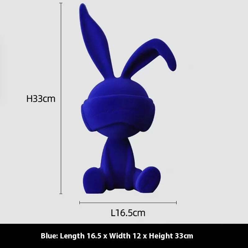 Green suede blindfold rabbit resin table ornament on a wooden shelf, showing detailed texture and 12cm height