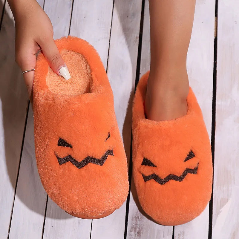 Orange Halloween pumpkin slippers with plush lining and non-slip PVC soles in UK sizes