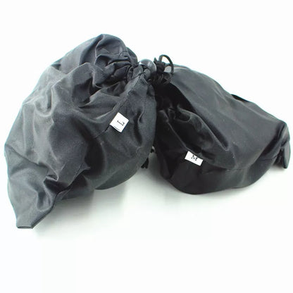 Reinforced large-tooth non-slip shoes in black and orange for superior traction on slippery surfaces