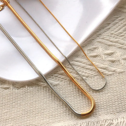 Golden snake bones chain necklace with geometric design, 3mm thick and 50cm long