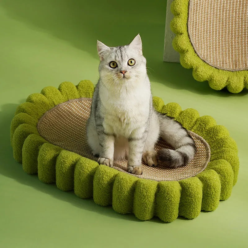 Green oval-shaped sisal cat scratching pad with a central bowl, serving as a cat bed and furniture protector.