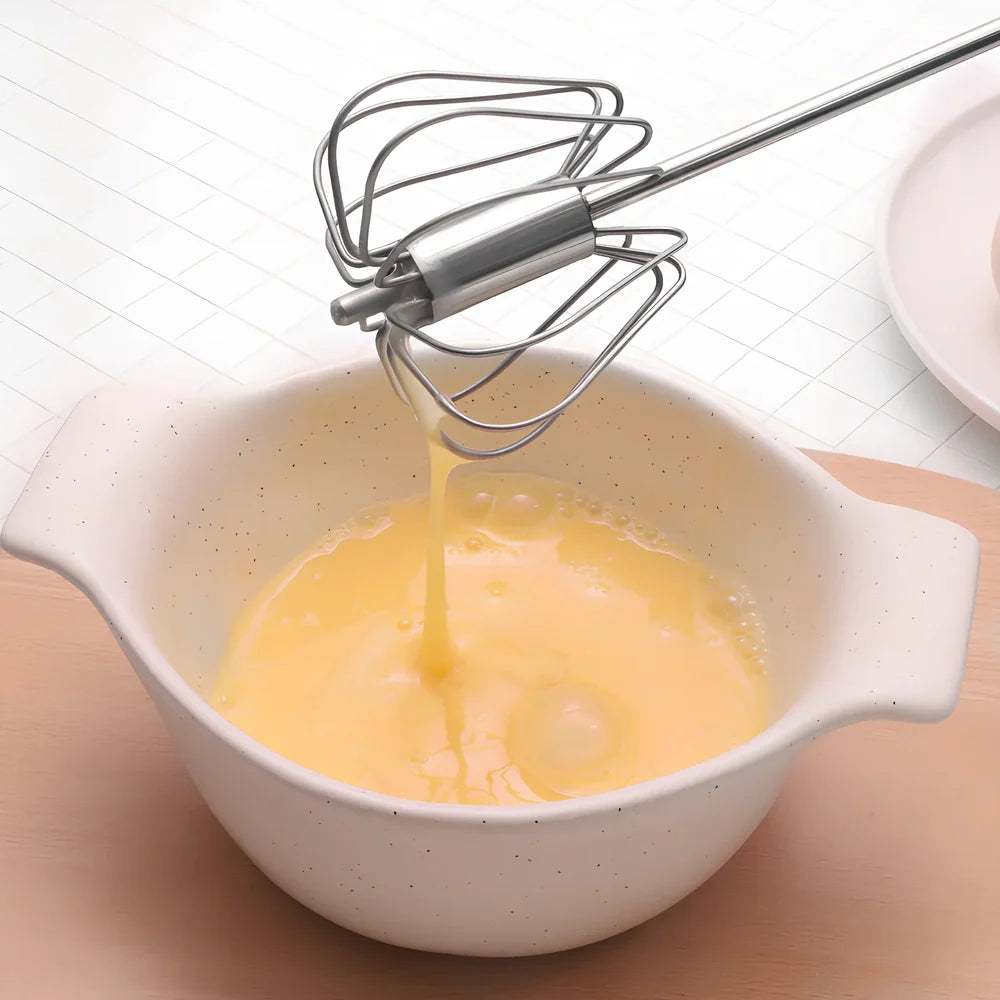 Self-spinning whisk with straight stainless steel design and black handle in multiple colours