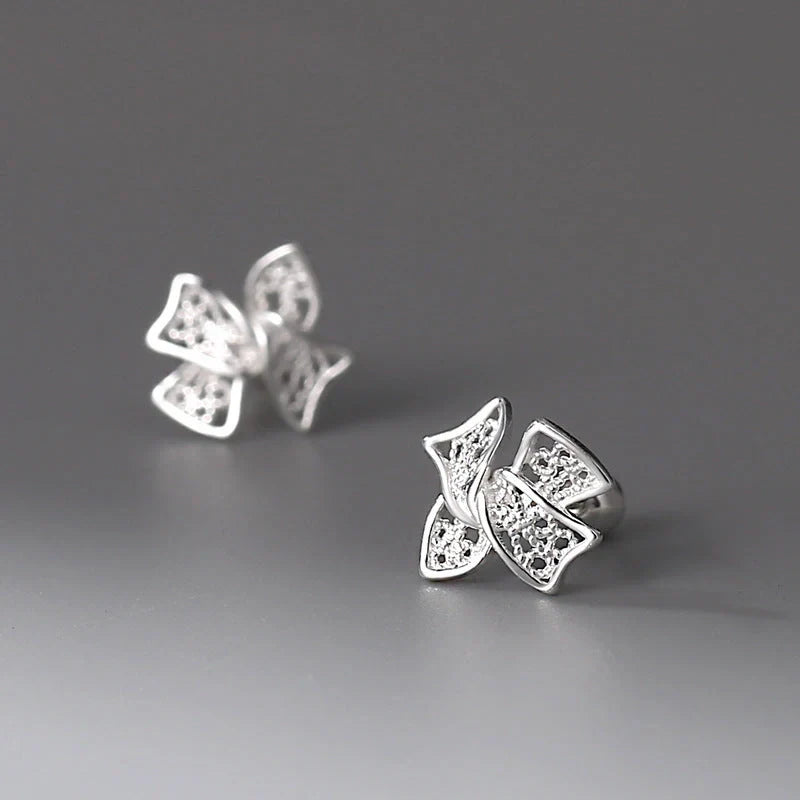 Elegant silver bow stud earrings for women, hypoallergenic and perfect for any occasion.