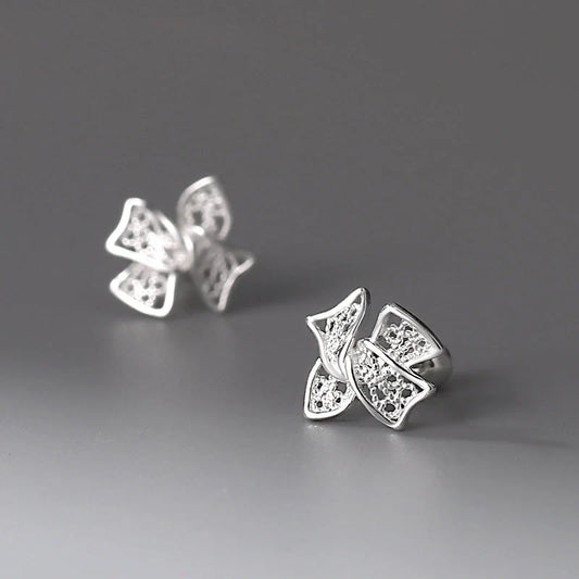 Elegant silver bow stud earrings for women, hypoallergenic and perfect for any occasion.