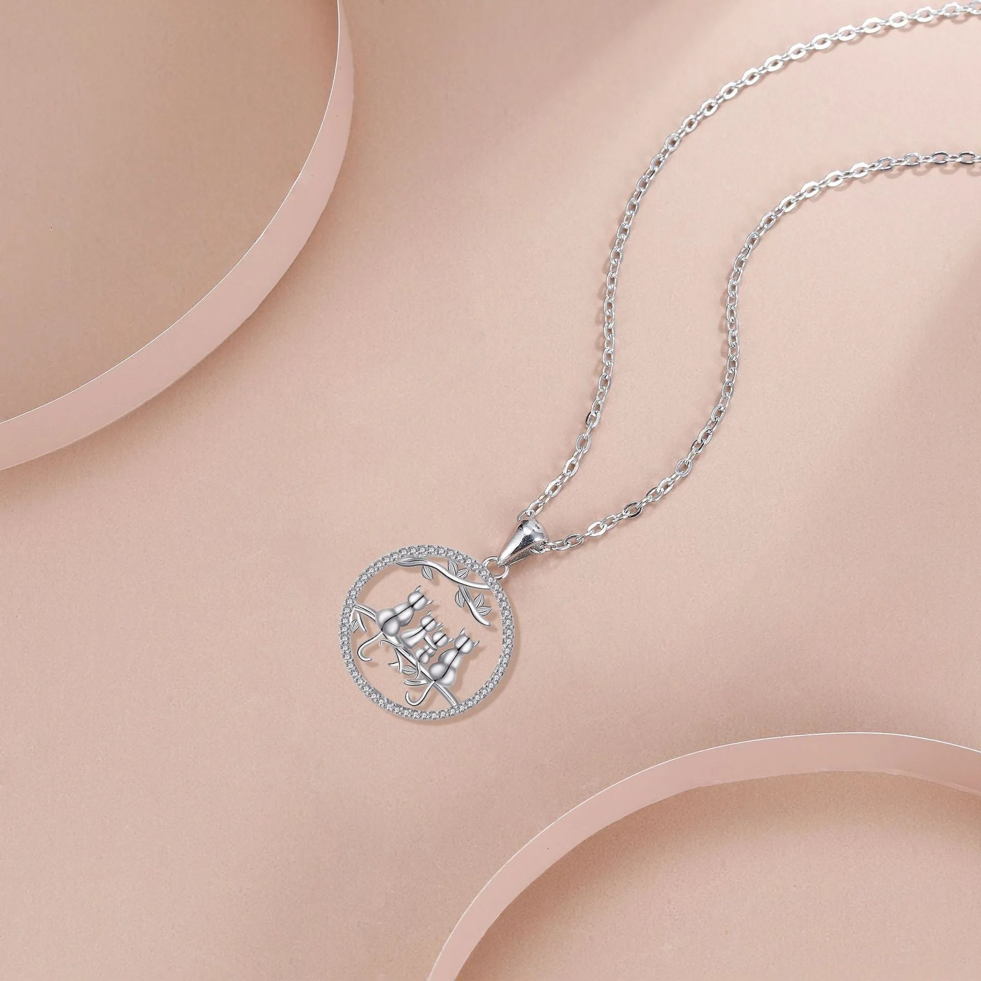 Copper necklace with a four kitten pendant on a cross chain, length 50 cm.