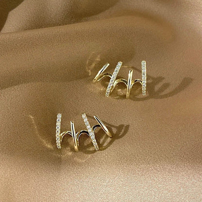 Elegant silver-tone zircon stud earrings with a sleek and sophisticated design