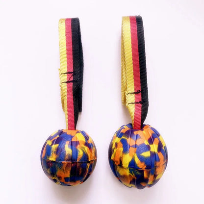 Camouflage and yellow EVA foam floating dog ball with knotted tetherball design.