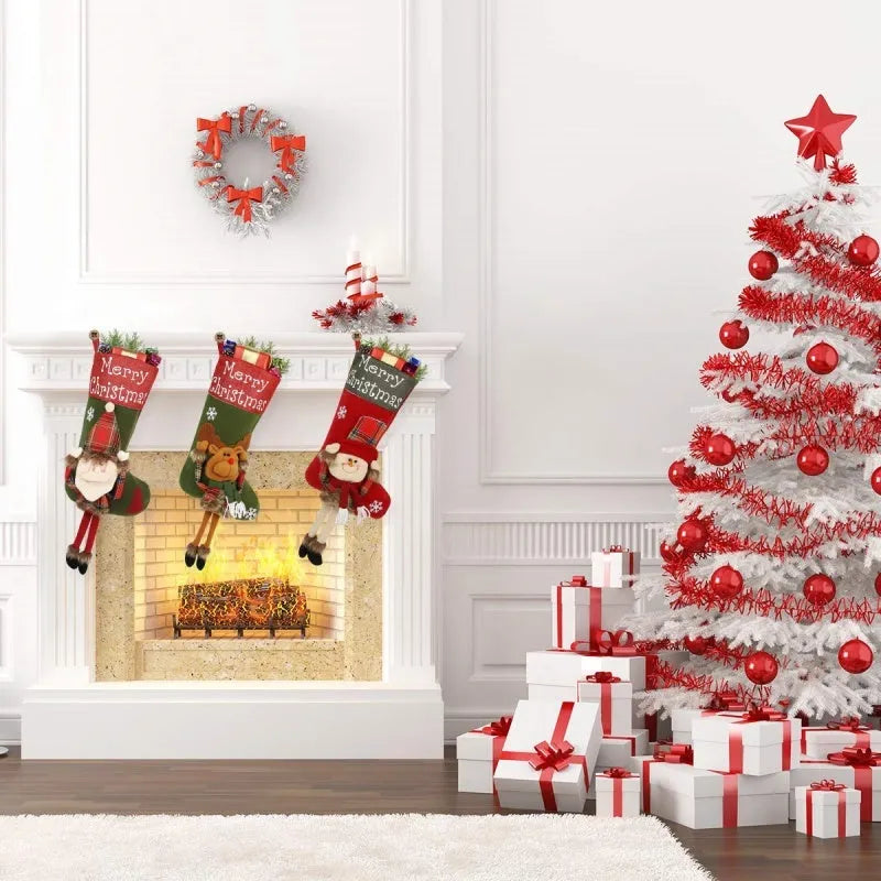 Set of three large red, white, and brown Christmas stockings with 3D Santa, Snowman, and Reindeer designs hanging on a tree.