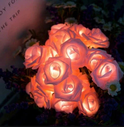 Battery-powered rose flower string lights in various colors and lengths, suitable for holiday, wedding, and party decor