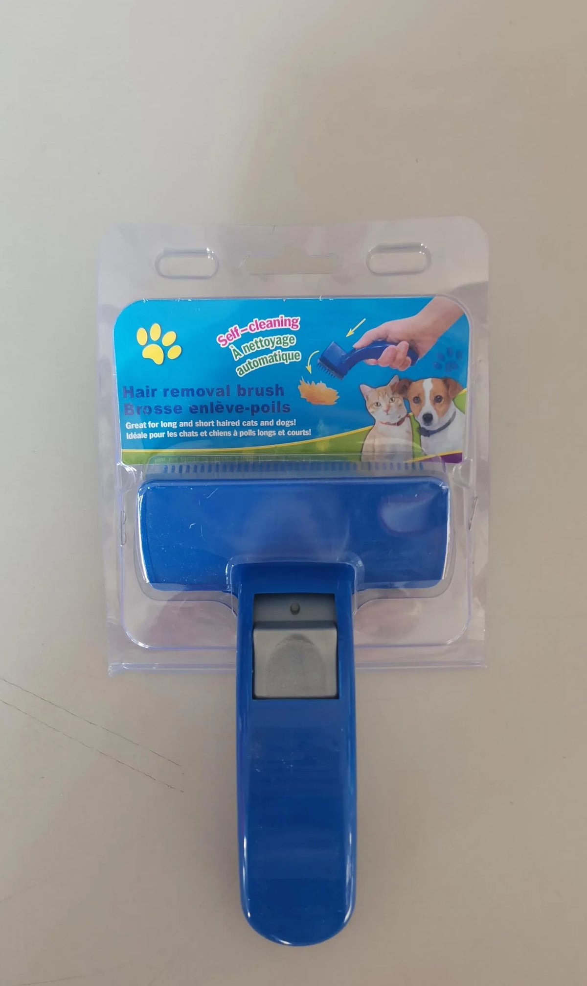Self cleaning pet brush comb for dogs and cats, plastic grooming tool measuring 16 x 10cm