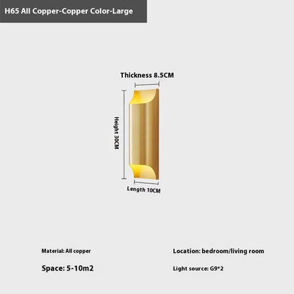 Minimalist copper wall lamp in black gold finish mounted beside bed