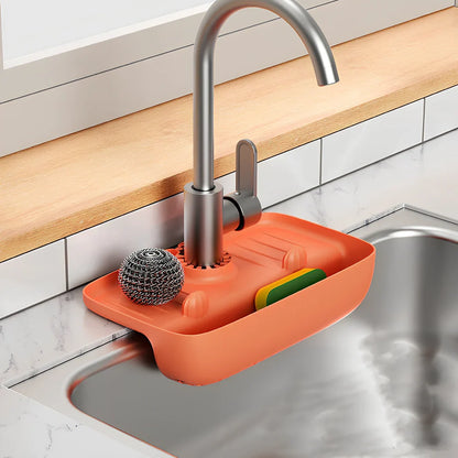 TPE kitchen drain rack with irregular shape measuring 27x14x5cm in orange colour