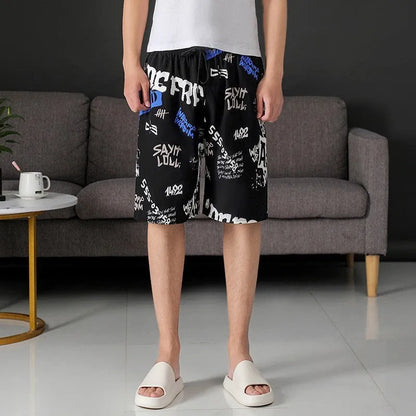 Man wearing loose-fitting striped beach pants made from quick-dry ice silk fabric.