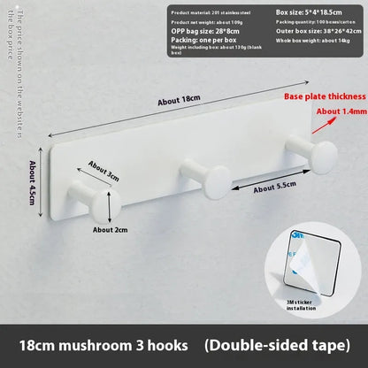 Screwless mushroom-style clothes hook with adhesive backing, shown in white on a tiled wall.