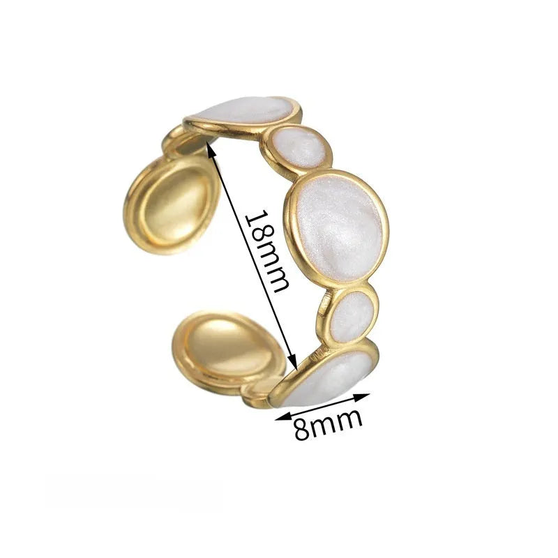 Adjustable geometric stainless steel ring with electroplated finish showing angular design and opening mechanism