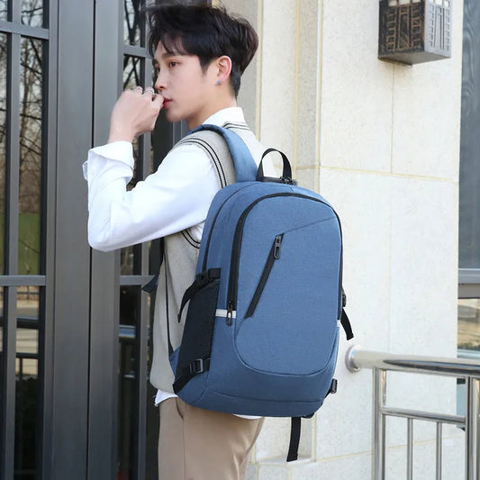 Men's grey computer backpack with 20-35L capacity showing Oxford cloth construction and organisational compartments
